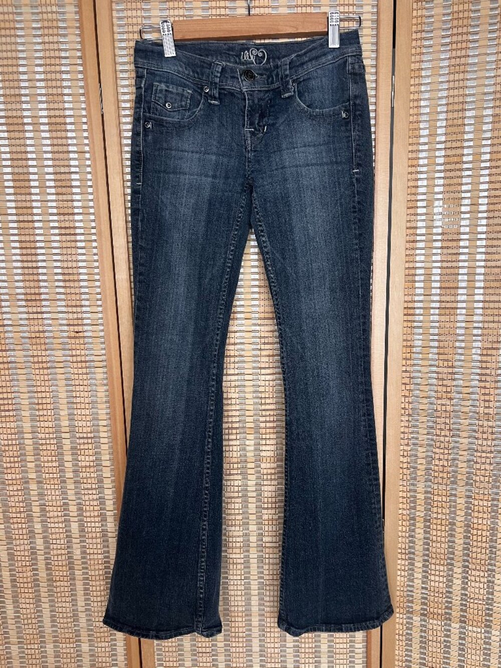 Vintage Y2K iLin low rise flared jeans in a dark wash denim size 0